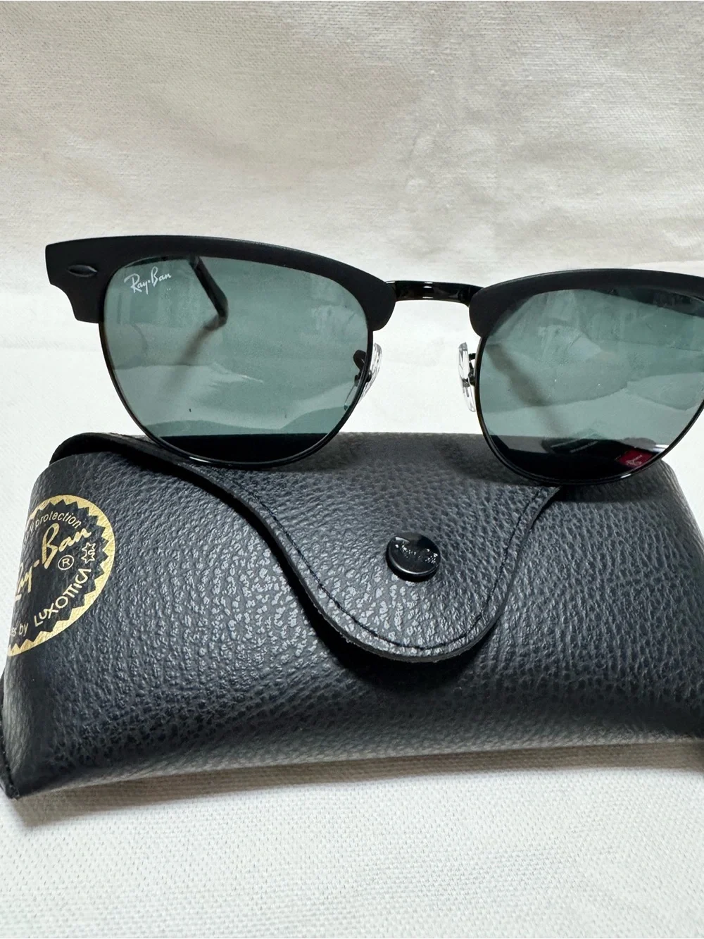Ray-Ban Black Frame Sunglasses with Green Lenses
